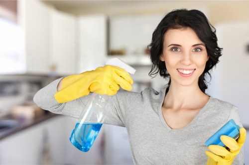 Professional carpet cleaner reviewing safety standards before starting work