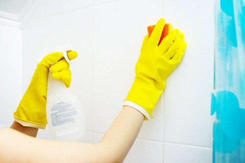 Technician handling cleaning products with care and following safety procedures